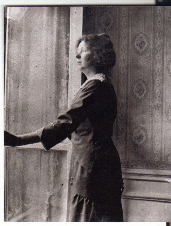 Christabel looking out of the window at 9 Rue Roy