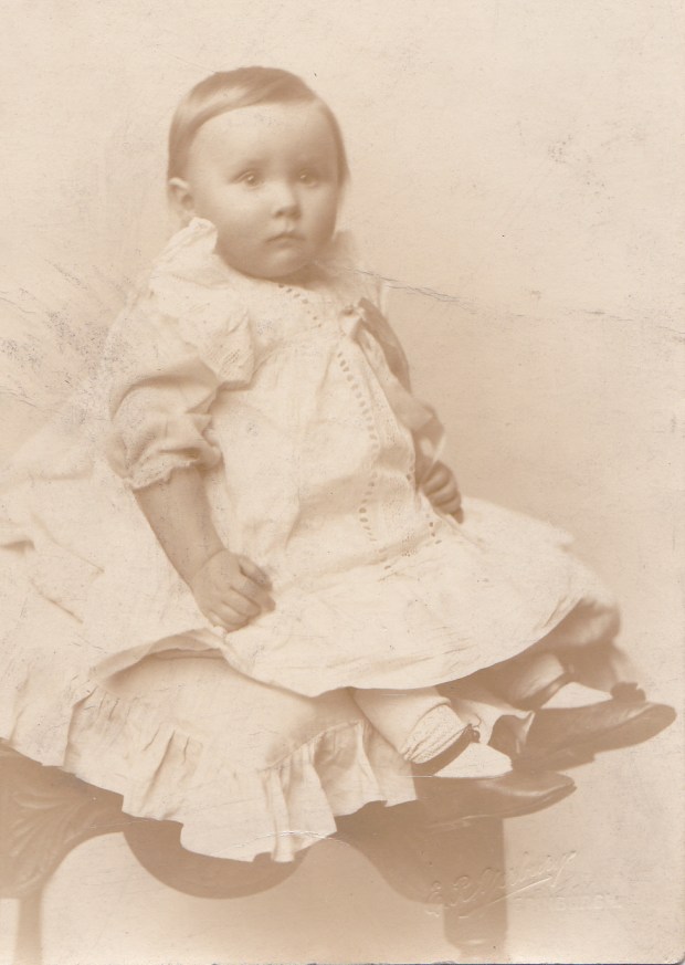 My mother, Christmas 1914. On the reverse of this postcard is written 'With Best Wishes for a Merry Xmas From Meg, Tom and the 'Wee Un'. 