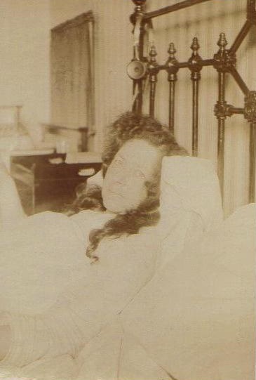 Kate in bed - headphones at the ready