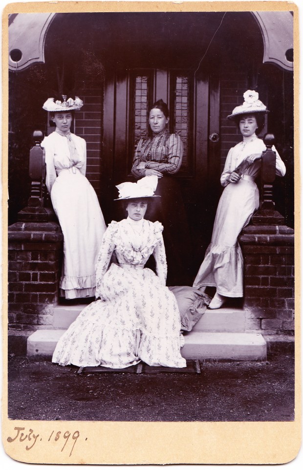 At the Fryes' home, The Plat at Bourne End. Abbie is standing on the left. Kate sits at her feet.
